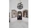 Spacious home entry with marble floors, brick archways and a decorative chandelier at 15061 W Pinchot Ave, Goodyear, AZ 85395
