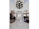 Spacious home entry with marble floors, arched doorways and a grand chandelier at 15061 W Pinchot Ave, Goodyear, AZ 85395
