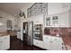 Kitchen with stainless steel appliances, built-in ovens, and decorative ironwork above at 15061 W Pinchot Ave, Goodyear, AZ 85395