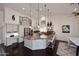 Spacious kitchen boasts stainless steel appliances, a gas cooktop, and an island with seating at 15061 W Pinchot Ave, Goodyear, AZ 85395