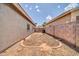 Enclosed backyard with gravel for easy upkeep and privacy at 15856 W Calavar Rd, Surprise, AZ 85379