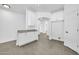 Bright and airy kitchen area featuring granite countertops and ample white cabinets perfect for culinary enthusiasts at 15856 W Calavar Rd, Surprise, AZ 85379