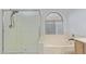 Bathroom featuring a glass-enclosed shower and a separate soaking tub by a window at 17128 E Kensington Pl, Fountain Hills, AZ 85268