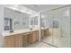Spacious bathroom with dual sinks, large mirror, and a separate tub and shower combo at 17128 E Kensington Pl, Fountain Hills, AZ 85268