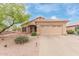 Charming single-story home with a well-maintained front yard and a two-car garage at 17128 E Kensington Pl, Fountain Hills, AZ 85268