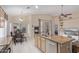 Open kitchen and dining area boasts an island with sink and granite countertops and stainless steel appliances at 17128 E Kensington Pl, Fountain Hills, AZ 85268