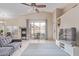 Living room boasts natural light with sliding glass doors and neutral decor at 17128 E Kensington Pl, Fountain Hills, AZ 85268