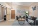 Inviting living room with modern decor, light wood floors, and barn door access at 17128 E Kensington Pl, Fountain Hills, AZ 85268