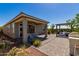 An outdoor kitchen, patio, pergola and a seating area in the backyard at 17656 W Bajada Rd, Surprise, AZ 85387