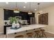 Kitchen featuring stainless steel appliances, a large island, and modern pendant lights at 17656 W Bajada Rd, Surprise, AZ 85387