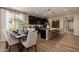 Modern kitchen with dark cabinetry, a center island, stainless steel appliances, and tile flooring at 17656 W Bajada Rd, Surprise, AZ 85387