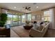 Sunlit living room featuring a large sliding glass door to the outdoor patio at 17656 W Bajada Rd, Surprise, AZ 85387