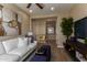 Living room featuring a comfortable sofa and decorative accent pieces at 17656 W Bajada Rd, Surprise, AZ 85387