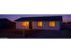 Charming single-story home with a well-manicured lawn and inviting curb appeal during twilight at 18828 N 17Th Dr, Phoenix, AZ 85027