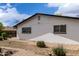 Backyard showing the side of the house with landscaping at 1985 S Plaza Dr, Apache Junction, AZ 85120
