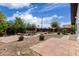 Backyard with landscaping, patio pavers, and a rock feature at 1985 S Plaza Dr, Apache Junction, AZ 85120