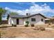 Backyard showing the back of the house with landscaping at 1985 S Plaza Dr, Apache Junction, AZ 85120