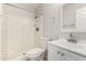 Bathroom featuring white tile shower, toilet and sink with a white vanity at 1985 S Plaza Dr, Apache Junction, AZ 85120