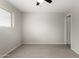 Bright bedroom featuring grey laminate flooring and a window with blinds at 1985 S Plaza Dr, Apache Junction, AZ 85120