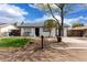 Charming home featuring black and white paint, modern design, and a well-kept front yard at 1985 S Plaza Dr, Apache Junction, AZ 85120