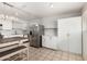 Spacious kitchen features stainless steel appliances, white cabinets, and a center island with seating at 1985 S Plaza Dr, Apache Junction, AZ 85120