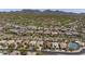 Expansive aerial view of luxury homes in a golf course community surrounded by mountains at 21397 N 78Th St, Scottsdale, AZ 85255