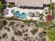 Stunning aerial view showcases a pool, patio, and desert landscaping at 21397 N 78Th St, Scottsdale, AZ 85255