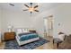 Bedroom featuring a ceiling fan and doorway to the ensuite bathroom at 21397 N 78Th St, Scottsdale, AZ 85255