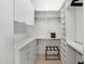 A spacious walk-in closet with custom white shelving and storage solutions at 21397 N 78Th St, Scottsdale, AZ 85255