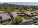Beautiful desert home with lush landscaping, mountain views, and a paver driveway at 21397 N 78Th St, Scottsdale, AZ 85255