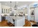 Gourmet kitchen with marble countertops, stainless steel appliances, custom cabinetry, and a large island at 21397 N 78Th St, Scottsdale, AZ 85255