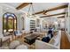 Open-concept living space with comfortable seating, exposed beams, and seamless indoor/outdoor living at 21397 N 78Th St, Scottsdale, AZ 85255
