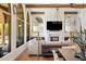 Elegant living room featuring a fireplace, wood beams, large windows, and hardwood floors at 21397 N 78Th St, Scottsdale, AZ 85255