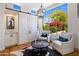Cozy sitting area with accent chairs and a view of the landscaped backyard at 21397 N 78Th St, Scottsdale, AZ 85255