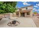Spacious backyard featuring a covered patio, refreshing pool, and cozy fire pit, perfect for outdoor relaxation at 2143 N Chestnut Cir, Mesa, AZ 85213