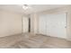 Comfortable bedroom with a ceiling fan and closet with doors, offering storage at 2143 N Chestnut Cir, Mesa, AZ 85213