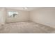 Bright bedroom featuring neutral walls and plush carpets, creating a relaxing atmosphere at 2143 N Chestnut Cir, Mesa, AZ 85213