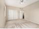 Cozy bedroom with neutral walls, soft carpet, closet, and an ensuite bathroom for added privacy at 2143 N Chestnut Cir, Mesa, AZ 85213