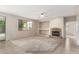 Spacious living room featuring a stone fireplace and ample natural light at 2143 N Chestnut Cir, Mesa, AZ 85213