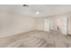 Carpeted main bedroom showcasing an ensuite bathroom and walk in closet, offering convenience at 2143 N Chestnut Cir, Mesa, AZ 85213