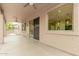 The covered patio provides outdoor space with ceiling fans and natural light at 2143 N Chestnut Cir, Mesa, AZ 85213