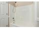 Clean bathroom area featuring a shower-tub combination and a handheld shower head at 2143 N Chestnut Cir, Mesa, AZ 85213