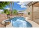 Beautiful swimming pool area surrounded by lush landscaping, creating a private oasis in the backyard at 2143 N Chestnut Cir, Mesa, AZ 85213