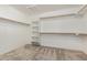 Spacious walk-in closet with carpet and shelving for optimal storage at 2143 N Chestnut Cir, Mesa, AZ 85213