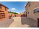 Private backyard featuring desert landscaping, a patio, and decorative wall art at 2167 S Luther Ave, Mesa, AZ 85209