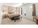 Cozy bedroom with a decorative lamp, bench seat, and carpeted flooring at 2167 S Luther Ave, Mesa, AZ 85209