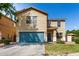Inviting two-story home featuring a blue two-car garage, landscaped front yard, and charming entryway at 2167 S Luther Ave, Mesa, AZ 85209