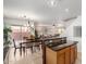 Open concept kitchen with island, granite counters, and views of the dining and living areas at 2167 S Luther Ave, Mesa, AZ 85209