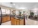 Open kitchen featuring an island and sliding door at 2167 S Luther Ave, Mesa, AZ 85209