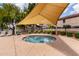 Relaxing community spa area featuring shade cover and well-maintained landscaping at 2167 S Luther Ave, Mesa, AZ 85209